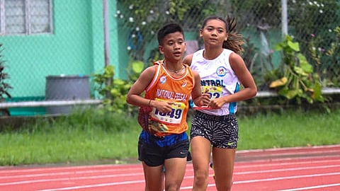 GOLDEN FINISH. Emar Human and Environmental College runner Mary Jane Pagayon finishes first to claim the gold medal in the youth girls 3,000-meter run of the National Prisaa (Private Schools Athletic Association) Games athletics competition held on Tuesday, July 23, in Legazpi City, Albay.