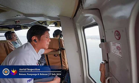 AERIAL INSPECTION. President Ferdinand Marcos, Jr. personally conducted an aerial inspection of Manila Bay areas in Bataan, Pampanga at Bulacan on July 27 to assess the oil spill from the sunken MT Terra Nova which capsized last Thursday off the waters of Limay, Bataan. (Photo from PBBM FB Page)