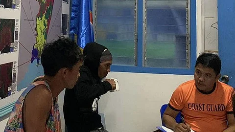 ZAMBOANGA. Personnel of the Philippine Coast Guard (PCG) rescue two fishermen in distress in the waters of Naga, Zamboanga Sibugay province, amid the inclement weather. A photo handout shows the two rescued fishermen (left) being interviewed by coast guard personnel. (SunStar Zamboanga)