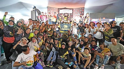 Members and supporters of the Tri-SND Barracudas celebrate as the team clinched their second consecutive Tribu Maisugon title at the IRONMAN 70.3 Davao last Sunday. The victory earned the team a P500,000 cash prize from the city government.
