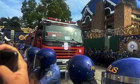 The firetruck owned by the Kingdom of Jesus Christ (KOJC) is parked outside the compound on Monday afternoon, September 2, 2024. The Philippine National Police plan to confiscate it. A sticker was posted on the firetruck stating that it will be used as evidence in court.