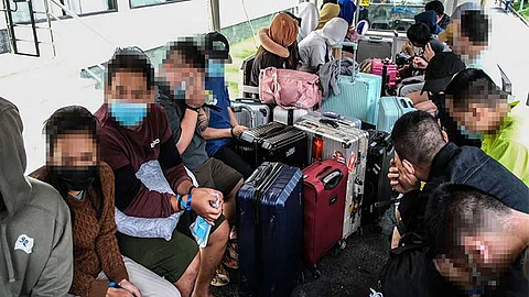 CHARGED. Some of the 169 foreign nationals, who were caught in an alleged Pogo raid at the Tourist Garden Hotel in Barangay Agus, Lapu-Lapu City on Aug. 31, 2024, were charged with human trafficking. /