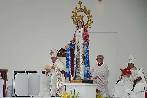 Pope Francis, left, leads the holy mass at Gelora Bung Karno Stadium in Jakarta, Indonesia, Thursday, Sept. 5, 2024.