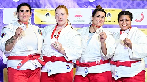 MEDALISTS ALL. Sydney Sy Tancontian of Davao City, right, wins a bronze medal for the Philippines at the close of the 2024 World Beach SAMBO Championships in Casablanca, Morocco over the weekend.