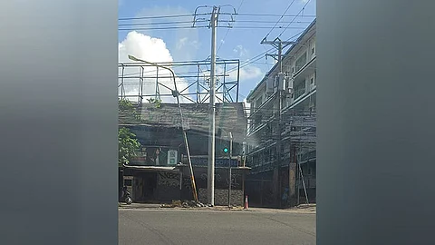 Neglected metal utility poles along P. del Rosario