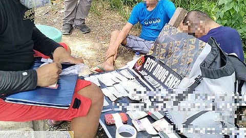 ILOILO. Iloilo City police officers pose with the seized illegal drugs and the arrested suspects.