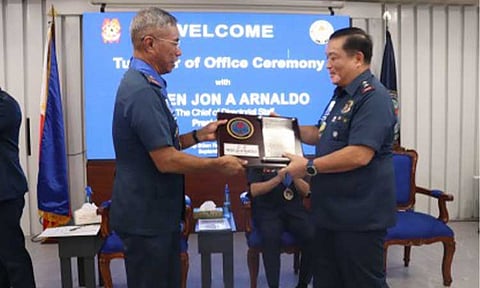 TURNOVER CEREMONY. New Criminal Investigation and Detection Group (CIDG) Director Brig. Gen. Nicolas Torre III (left) hands over Presentation of Memento to outgoing CIDG chief Maj. Gen. Leo Francisco in a turnover ceremony at Camp Crame in Quezon City on Thursday (Sept. 26, 2024). Torre said unity and teamwork will remain essential to the CIDG's continued success.