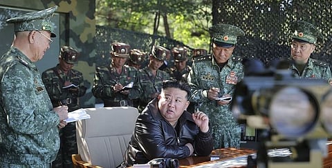 In this photo provided by the North Korean government, North Korean leader Kim Jong Un, center, visits a special operation forces unit at a western district in North Korea Wednesday, Oct. 2, 2024. Independent journalists were not given access to cover the event depicted in this image distributed by the North Korean government. The content of this image is as provided and cannot be independently verified. Korean language watermark on image as provided by source reads: "KCNA" which is the abbreviation for Korean Central News Agency.