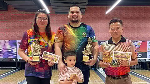 PROUD DABAWENYOS. From left, runner-up Crystal Chavez, champion Jesrael Rule and his child, and fourth-placer Art Galendez of Davao Tenpin Bowlers Association (Datba) celebrate their victories in the mixed open masters division of the recently concluded 1st Metro Cagayan Invitational Open Championships, held at SM Bowling Center in Cagayan de Oro City.