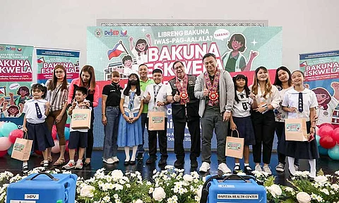 Education Secretary Sonny Angara and Health Secretary Teodoro Herbosa, along with parents and students, during the nationwide launch of Bakuna-Eskwela at Dr. A. Albert Elementary School in Manila.