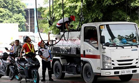 CLIMBING PRICES. A truck refuels at a gasoline station in Intramuros, Manila in this photo taken on July 9, 2024. Oil firms announced a big-time hike in fuel prices to take effect on Tuesday (Oct. 15, 2024). (PNA file photo by Yancy Lim)