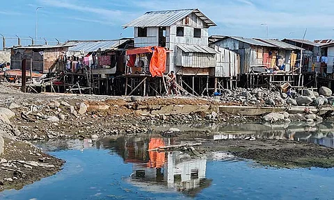 LIFE CONTINUES. Informal settlers located near Magsaysay Park in Davao City continue to live their normal life amid the construction of the Sta. Ana Wharf Bridge, a bridge project which is part of the ongoing multi-billion Davao City Coastal Road project.