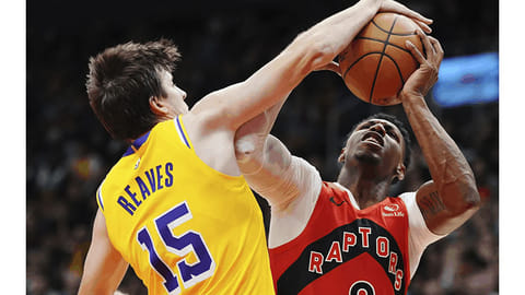 Raptors rout Mavericks as Barrett reaches milestone