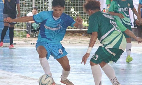 Action between Puerto Princesa and Negros Occidental in the boys' under-17 futsal finals in the Batang Pinoy National Championships at the Ramon V. Mitra Jr. Sports Complex, November 28, 2024.