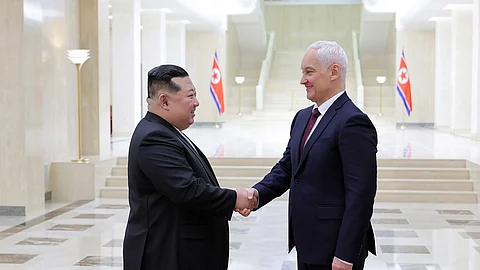 In this photo provided by the North Korean government, North Korean leader Kim Jong Un, left, shakes hands with Russian Defense Minister Andrei Belousov in Pyongyang, North Korea Friday, November 29, 2024.
