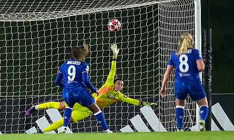 Chelsea's Catarina Macario, left, scores the second goal from penalty during the women's Champions League, group B soccer match between Real Madrid and Chelsea at the Alfredo Di Stefano stadium in Madrid, Spain, Tuesday, Dec. 17, 2024.