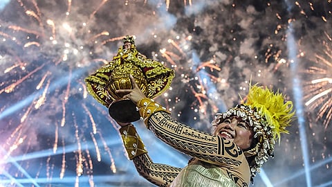 CEBU. The festival queen of Lumad Basakanon raises the Blessed Sto. Niño as they clinch victory in both the street dancing and ritual showdown of the Sinulog sa Dakbayan 2025 on January 12, 2025.