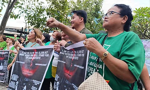 'STAND FOR VP SARA'. Supporters of Vice President Sara Duterte gather at Roxas Freedom Park for the simultaneous Indignation Rally and candle lighting ceremony on Sunday, February 9, 2025.