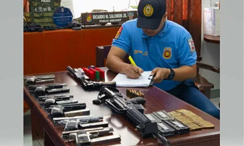 SURRENDERED. A police officer accounts for eight firearms and ammunitions surrendered by alleged private armed group members in Barangay Papaya, San Antonio, Nueva Ecija on Friday (Feb. 7, 2025). Police Regional Office-Central Luzon chief Brig. Gen. Jean Fajardo encouraged other groups to surrender their unlicensed firearms in compliance with the election gun ban. (Photo courtesy of PRO-3)