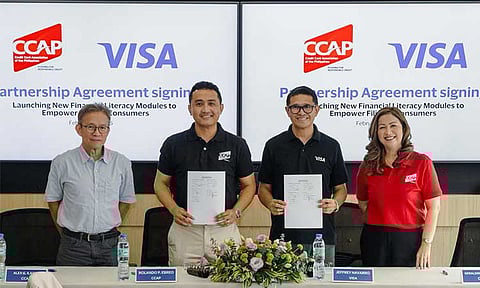 (From left) Credit Card Association of the Philippines (CCAP) Executive Director Alex Ilagan, CCAP Chairman Rolando Ebreo, Visa Philippines Country Manager Jeff Navarro, and CCAP President Geraldine Liggayu during the signing of the partnership agreement.