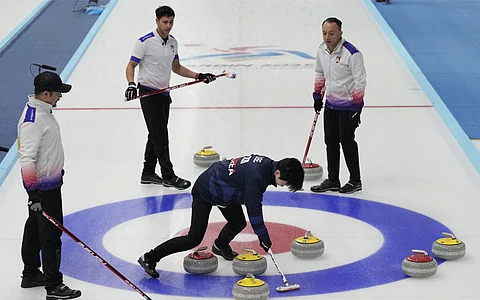 South Korea's Lee Jaebeom (center) plays against Philippines during the finals of men's curling at the 9th Asian Winter Games in Harbin, China on Friday, February 14, 2025.