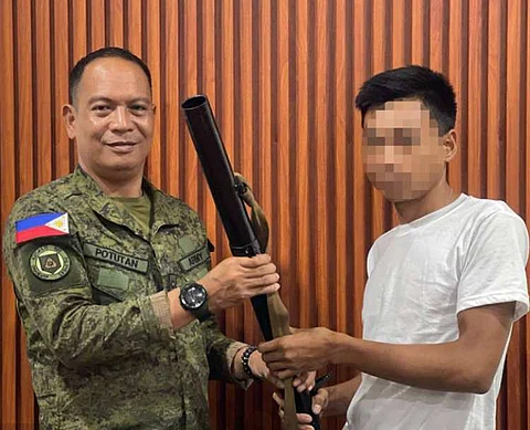 ZAMBOANGA. Four members of the Dawlah Islamiya-Maute Group (DI-MG) surrender to government authorities in Malabang, Lanao del Sur on Thursday, March 13. A photo handout shows one of the four surrenderers handing over a rocket-propelled grenade launcher to Lieutenant Colonel Abel Potutan, 64th Infantry Battalion commander (left), when they surrendered at the headquarters of the battalion in Matalin village, Malabang.