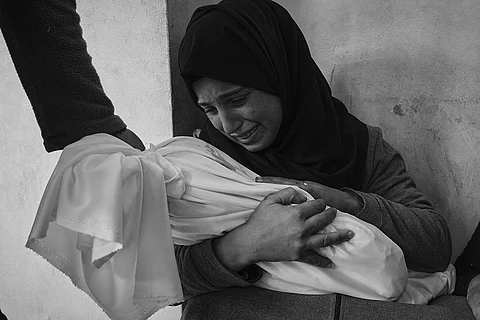 UN to reduce staff in Gaza, blaming Israel for a strike that killed its employee