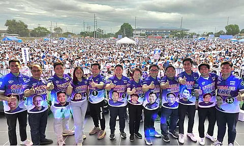 TEAM GELD-JUN
More than 30,000 supporters of Mabalacat mayoralty candidate Geld Aquino, vice mayorable Jun Castro and their council bets, show unity and support for the team during the candidates' opening salvo in Barangay Mabiga on Saturday.
Photo by Chris Navarro