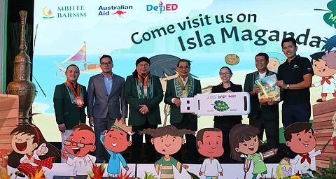 Minister Mohagher Iqbal is accompanied by Australian Embassy officials Vivienne Sykes and Peter Carreon at the Isla Maganda materials handover. Also present are MBHTE officials: Basic Education Director General Abdullah Salik Jr., Higher Education Director General Marjuni Maddi, Atty. Mojahid Guro, Chief of the Legal Division, and Mobarak Pandi, Chief of the Information and Communications Division. Photo from Pathways.