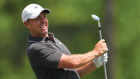 McIlroy shoots 66 to get back into contention
