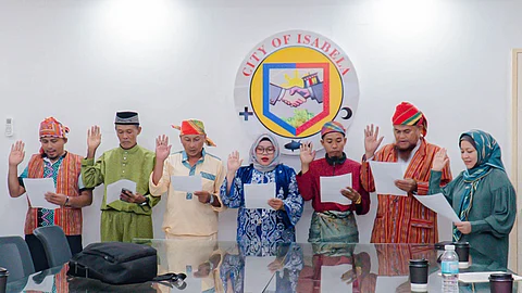 ZAMBOANGA. The City Government of Isabela in Basilan province, in affirmation of its commitment to inclusive and participatory governance, appoints Indigenous Peoples Mandatory Representatives (IPMRs) in six villages of the city. A photo handout shows Isabela City Mayor Sitti Djalia Turabin-Hataman (right) administered the oath-taking ceremony for the newly-appointed IPMRs at City Hall on Friday, April 11, 2025. (SunStar Zamboanga)