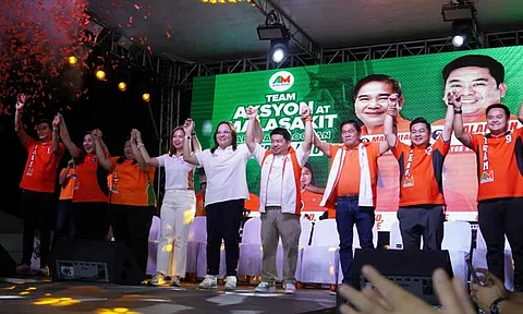 Team Aksyon at Malasakit raising the hands of Trabaho first nominee Atty. Johanne Bautista at the Distrito Uno Grand Rally in Caloocan.