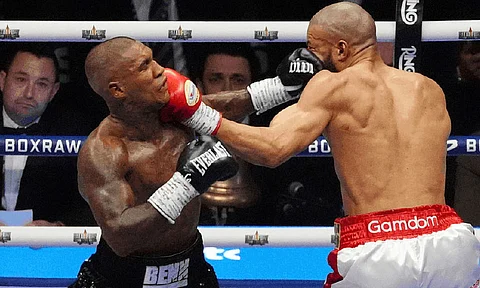 PUNCH EXCHANGE. Chris Eubank Jr. (right) and Conor Benn land simultaneous punches to each other’s faces during their middleweight bout in London. / PA via