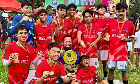 SOARING EAGLES. The Holy Child College of Davao (HCCD) Red Eagles celebrate their boys’ under-16 championship at the 19th Del Monte Football Cup held over the weekend in Manolo Fortich, Bukidnon.