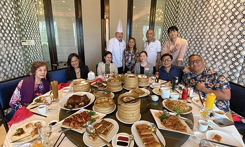 FEAST. Hotel and media personnel at the Yum Cha launch. Seated are (from left): CVU; Chie Blas, director of sales and marketing; Kayzyl Ramiro, front office manager; Chenny Mae Elpa, sales and marketing coordinator; Xavier Gonzales Solis and Carlo Olano. Standing are (from left): Chef Kenny Yong, Aissa Dela Cruz, Nestor Alonso and Doyzkie Buenaviaje.