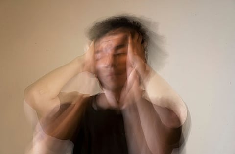 This photo depicts a man experiencing a mental health condition.