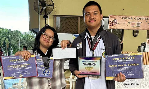 CHAMPION DUO. Niña Kate T. Garrido and Daniel Day B. Doneza of Davao City National High School emerged as champions in the Inter-High School Statistics Quiz Bowl held at UP Mindanao on November 22, 2024.