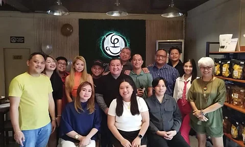 pose. Precious Brew Cafe team with Cebu online news reporters and content creators.