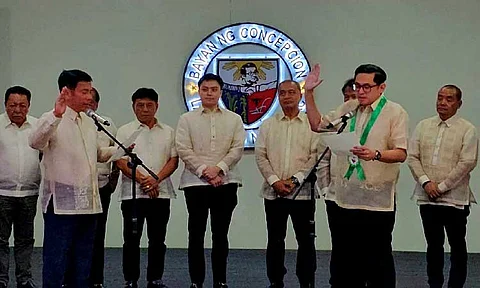 Mayor Noel Villanueva (left) administers the oath of office of Senator-elect Bam Aquino at the Concepcion town hall in Tarlac on Friday morning, May 30, 2025. Photo by Chris Navarro