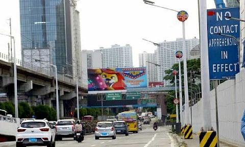EDSA REBUILD. Vehicles pass by a “No Contact Apprehension" signage along Epifanio Delos Santos Avenue (EDSA) in Quezon City on May 24, 2025. The Department of Transportation on Thursday (May 29) announced a toll holiday for the Skyway Stage 3 and the North Luzon Expressway (NLEX) Connector Road beginning June 13 to help address vehicular traffic from the EDSA rebuild project. (PNA photo by Joan Bondoc)