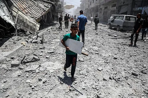 PALESTINIANS are seen among the rubble of destroyed houses after an Israeli airstrike in Gaza City on May 31, 2025. /