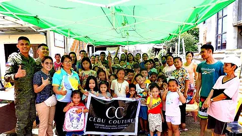 ILOILO. The 61st Infantry (Hunter) Battalion of the Philippine Army, in partnership with Cebu Couture and Otso Marino, distributes school supplies and provides free haircuts to students during the “Balik Eskwela” outreach on June 7 and 8, 2025, in Tigbauan, Iloilo.