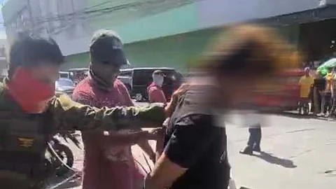 Joint operatives of the 1st Marine Brigade and Anti-Kidnapping Group arrest Abdulpatac Pantacan, a dismissed policemen link to several criminal activities. The suspect (right) was arrested along Almonte Street, Poblacion 5 village, Cotabato City, on Monday, June 9, 2025. (SunStar Zamboanga)