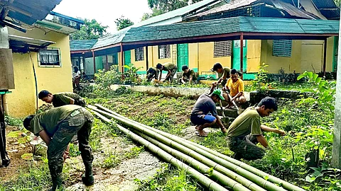 Soldiers from the Philippine Army’s 61st Infantry Battalion provide free haircuts and assist with school clean-up during the Brigada Eskwela 2025 Kick-Off in Iloilo and Antique on June 9, 2025, as part of their commitment to support education and community development. (Photo courtesy of the 61IB)
