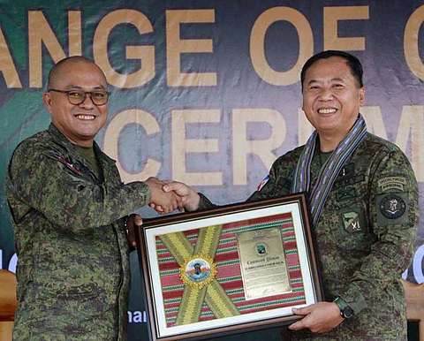 ZAMBOANGA. Major General Leonardo Peña, 11th Infantry Division commander (right), presents the Command Plaque to Lieutenant Colonel Homer Estolas for his steadfast dedication as the 21st Infantry Battalion commander. Estolas relinquished his post to Lieutenant Colonel Roland Borras, in a Change of Command Ceremony, on Wednesday, June 11.