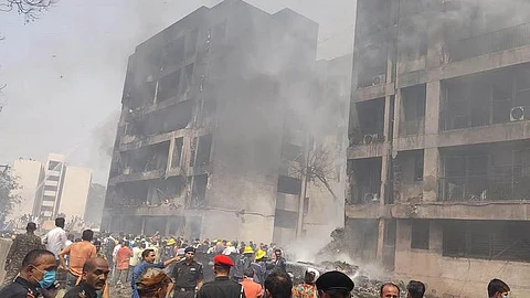 People and rescuers are seen at a site of a plane crash in Ahmedabad of India's Gujarat state, June 12, 2025. (Xinhua)