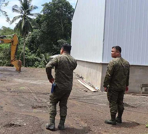 ZAMBOANGA. Lieutenant Colonel Rolando Vargas, Jr., 53rd Infantry Battalion (right), on Thursday, June 12, leads the inspection to ensure that the Department of Agriculture-funded road construction project in the remote village of Tinotungan in Tukuran, Zamboanga del Sur is free from disruption and threats from lawless elements.