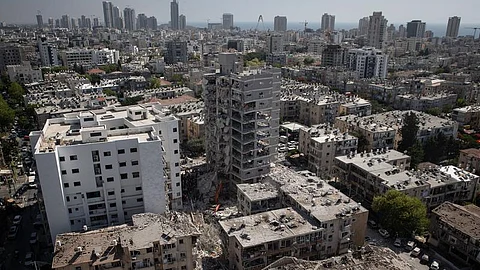 This photo taken on June 15, 2025 shows buildings damaged by a missile fired from Iran in Bat Yam, central Israel. According to Israel's state-owned Kan TV News, the death toll from Iran's strikes since Friday has reached 14. (Xinhua)
