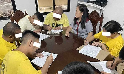ENROLLED
Eight PDLs at the City of San Fernando District Jail process their enrollment to the City College of San Fernando, Pampanga under the city government’s Project AKBAY. - Photo from CSFP-CIO