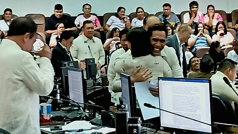 Councilors bid each other friendly goodbye